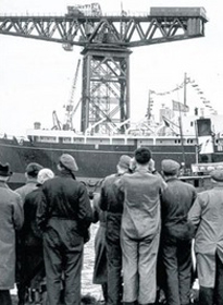 Titan in the background as by-standers view the launch of the Royal Yacht Britannia in April 1953 